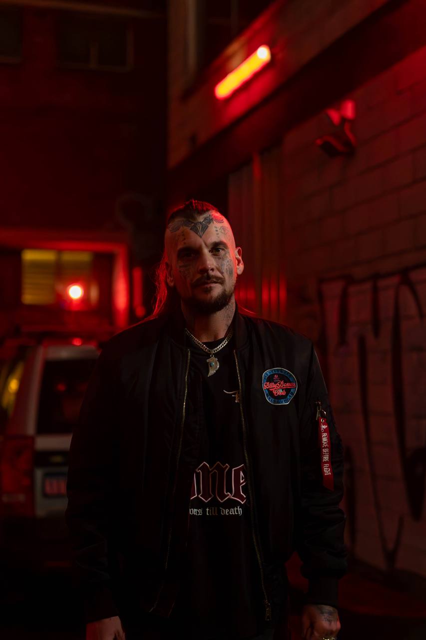 Pete on a night shoot under red neon lights
